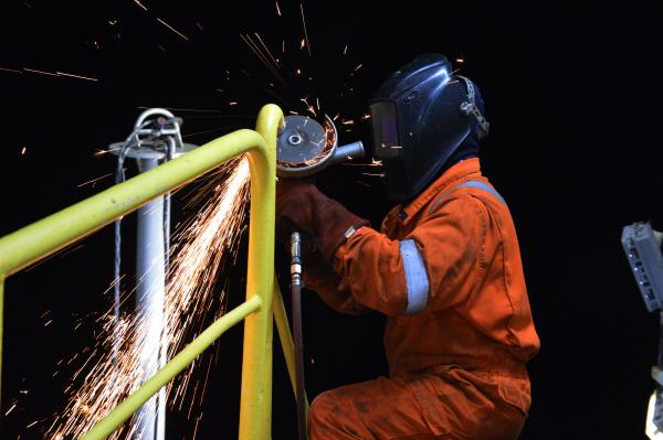 SIEM Offshore welding a safety railing