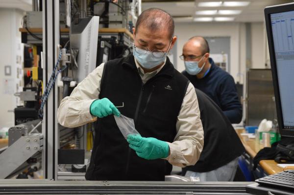 Jiabo Liu taking a sample from a core