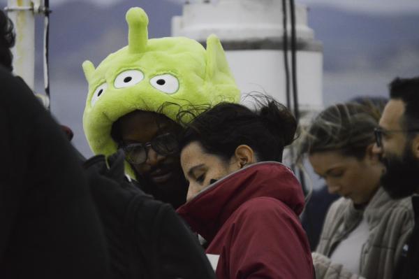 Nick Logan (left) and Natacha Fabregas showing each other pictures as they pass through the gibraltar strait