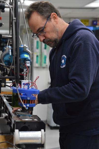 Javier Hernandez-Molina prepares a core section on the Section Half Multisensor Logger (SHMSL)