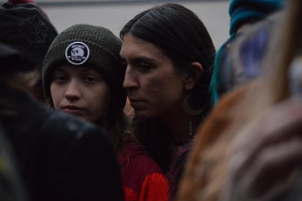 Peering through the crowd at a drag show