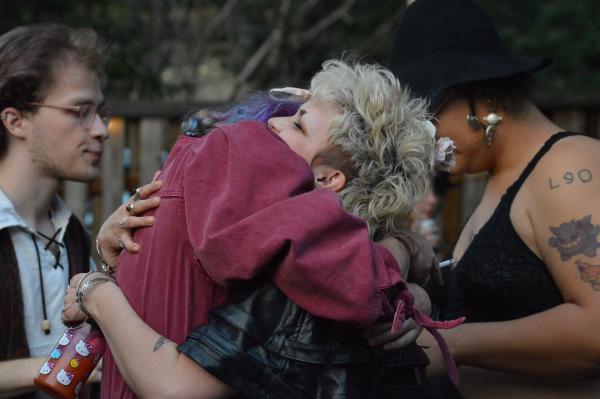A tight hug at a house party